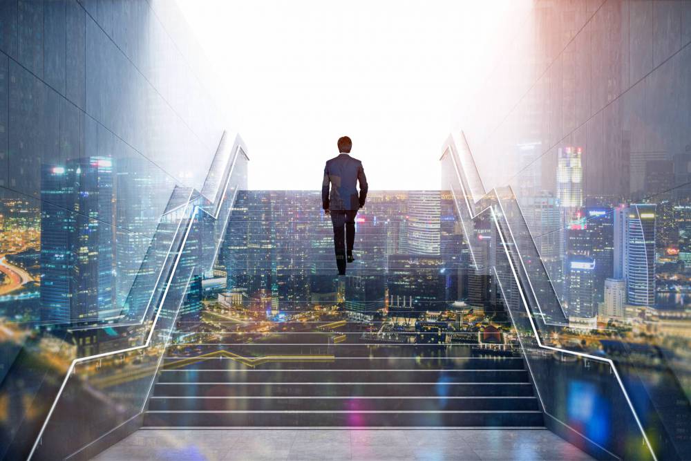 Rear,View,Of,A,Businessman,Climbing,Stairs,To,Get,To