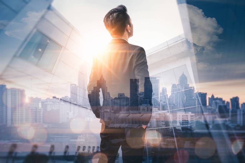The,Double,Exposure,Image,Of,The,Business,Man,Standing,Back