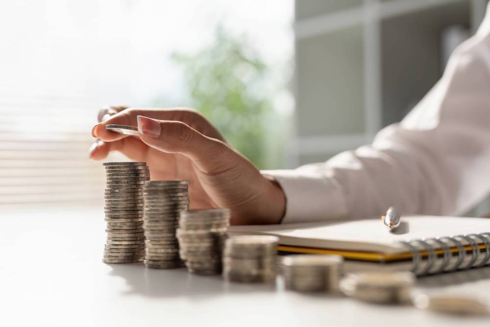 Young,Asian,Woman,Making,Stack,Of,Coin.,Invest,Save,Finance