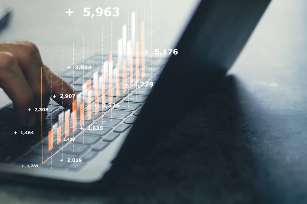 Laptop,Or,Computer,With,Chart.,Investment,In,Business,And,Financial